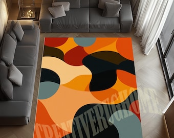 May include: A vibrant area rug with an abstract design. The rug showcases a pattern of overlapping shapes in shades of orange, red, black, and blue. The rug is placed in a living room setting with grey sofas and wooden flooring.