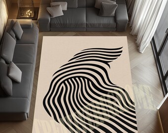 May include: A large, rectangular rug with a cream background. It features a striking abstract design of black, curved lines forming a flowing, wave-like pattern. The rug is placed in a living room setting, adding a modern touch.