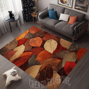 May include: A brown, red, and beige area rug with a leaf pattern. The rug features a variety of leaf shapes and sizes, with some leaves overlapping others. The leaves are arranged in a random pattern, creating a visually interesting design. The rug is made of a soft, durable material and is perfect for adding a touch of nature to any room.