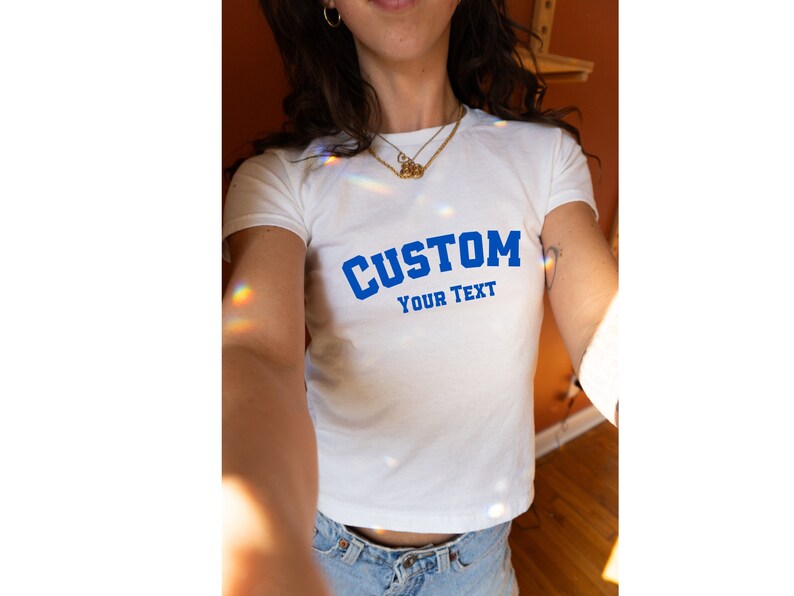 Customizable white baby tee for women with blue CUSTOM YOUR TEXT design, ready for personalized messaging,Custom Women's Fitted Tee, Custom Text Baby Tee, Custom Text Shirt, Personalized Shirt, Gift for her, Y2K Baby Tee, Retro 90s Style Tee