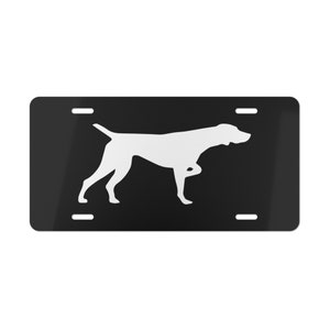May include: Black and white silhouette of a German Shorthaired Pointer dog on a black license plate.