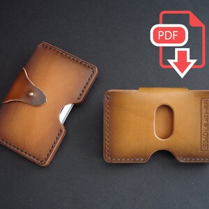 May include: Two brown leather card holders. One has a flap with a metal button and the other has a single card slot. Both have stitched edges and the text "TEMOLEATHER" is embossed on the right card holder.