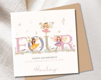 May include: A birthday card featuring the word "FOUR" with fairy illustrations. The card includes the text "HAPPY 4TH BIRTHDAY TO MY GORGEOUS LITTLE GIRL" and a name in cursive. The card is presented with a brown envelope.
