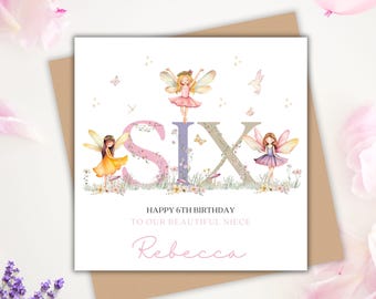 May include: A square birthday card with the word "SIX" in large letters, decorated with fairies and flowers. The card reads "Happy 6th Birthday To Our Beautiful Niece Rebecca."