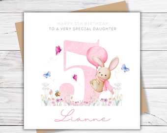 May include: A pink and white birthday card with a pink number 5, a bunny holding a balloon, and the text "Happy 5th Birthday to a very special daughter" and "Lianne".