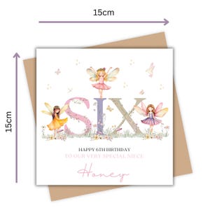 May include: A square birthday card, 15cm x 15cm, with the word "SIX" in large, floral letters. The card features illustrations of fairies and the text "Happy 6th Birthday To Our Very Special Niece Honey."