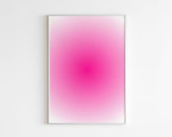 Puede incluir: Una impresión de arte mural rectangular que presenta un degradado rosa vibrante que transita desde un centro magenta profundo y saturado hacia un tono rosa suave y claro en los bordes, todo dentro de un marco de metal plateado fino y simple.