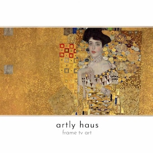 May include: A rectangular digital art display featuring Gustav Klimt's Portrait of Adele Bloch-Bauer I, characterized by extensive gold leaf patterns, geometric shapes, and a central figure. Below the artwork, the text reads artly haus frame tv art.
