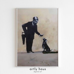 May include: A framed wall art print featuring a black and white stencil-style illustration of a person in a dark suit holding a hand saw behind their back while offering a treat to a small dog. The text artly haus digital art appears below.