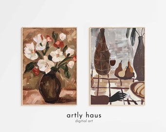 May include: Two rectangular wall art prints featuring painted scenes. The left print shows white flowers in a dark brown vase against a brown background. The right print depicts a table setting with two vases, pears, and a glass of red wine.