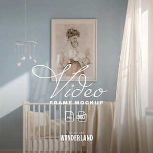 May include: A nursery scene with a framed artwork of a mother and child, a white crib, and a hanging mobile. The artwork is in a white frame. The text "Video Frame Mockup" is overlaid on the image. The overall color scheme is soft and pastel.