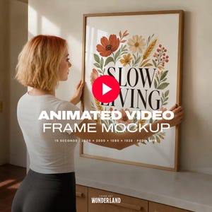 May include: A rectangular wooden frame containing a white poster with the text SLOW LIVING in black serif font, surrounded by a colorful botanical illustration of red, orange, and yellow flowers, green leaves, and wheat stalks on a white background.