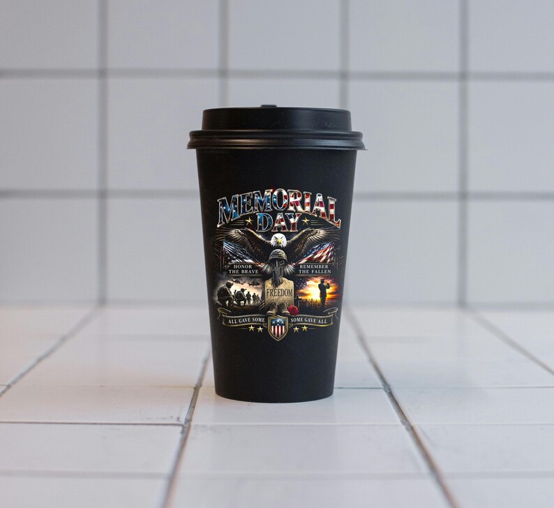 May include: Black travel mug with a black lid. The mug features a patriotic design with an eagle, American flag, and the words "Memorial Day," "Freedom," and "Honor the Brave." The design includes the text "All Gave Some, Some Gave All."