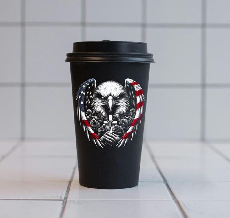 May include: Black reusable coffee cup with a graphic of a bald eagle with wings spread, holding a cross. The eagle is surrounded by a red, white, and blue American flag design.