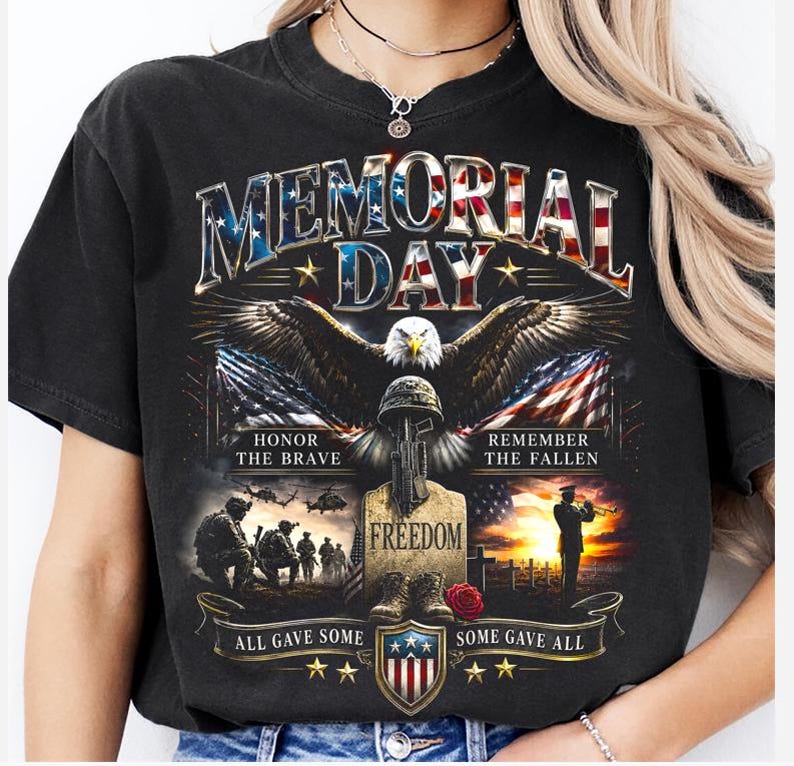 May include: Black t-shirt with a patriotic Memorial Day design. Features an eagle, American flags, and text that reads "Memorial Day", "Honor the Brave", "Remember the Fallen", "Freedom", "All Gave Some", and "Some Gave All".