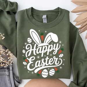 May include: Green sweatshirt with a white bunny rabbit graphic and the text "Happy Easter" in white.