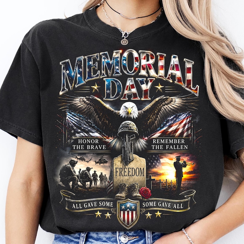 May include: Black t-shirt with a Memorial Day graphic. The design features an eagle, American flag, military helmet, boots, and the text "MEMORIAL DAY", "HONOR THE BRAVE", "REMEMBER THE FALLEN", "FREEDOM", "ALL GAVE SOME", and "SOME GAVE ALL".