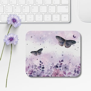 May include: Purple and white mouse pad with a watercolor design of butterflies, flowers, and stars.