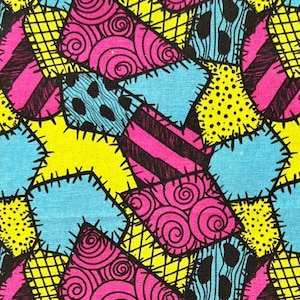 May include: A patchwork fabric design with a variety of colors and patterns, including blue, yellow, pink, and black. The fabric features a repeating pattern of stitched squares and triangles.