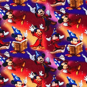 May include: A colorful fabric with a repeating pattern of Mickey Mouse dressed as a wizard. He is wearing a blue hat with a crescent moon and stars, a red robe, and yellow gloves. He is holding a book, a wand, or a magic spell. The background is a red, orange, and purple gradient with stars.