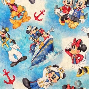 May include: Fabric featuring a nautical theme with cartoon characters. Mickey and Minnie Mouse, Goofy, and Pluto are depicted in sailor outfits and on a ship. Red anchors and a blue and white sky background complete the design.