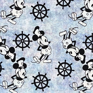 May include: A blue and white fabric with a repeating pattern of black and white Mickey Mouse characters and ship wheels. The Mickey Mouse characters are in various poses, including standing, sitting, and lying down. The ship wheels are all the same size and have eight spokes.