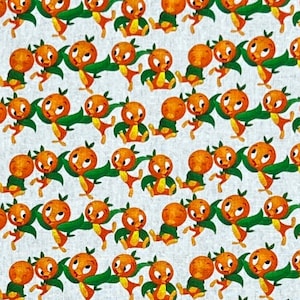 Tela 100% algodón con estampado de pájaros naranjas