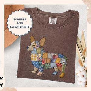 May include: Espresso-colored t-shirt with a patchwork corgi design. The corgi is made of various fabric patterns and colors. The shirt also has the text "T-SHIRTS AND SWEATSHIRTS" and "Espresso t-shirt".