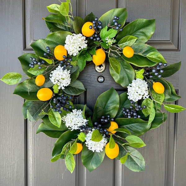 Spring and Summer wreath for front door, faux lemons, blueberries and white hydrangeas with lemon leaves and magnolia leaves.