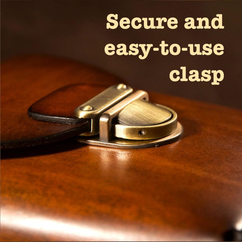 May include: Close-up of a brown leather item with a brass clasp. The clasp is a secure and easy-to-use design, with the words "Secure and easy-to-use clasp" in the image. The leather has a rich, warm tone.
