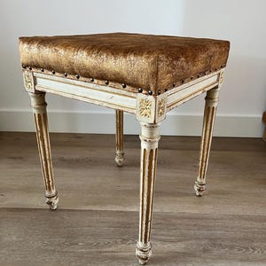 Vintage Gustavian stool/footstool, white legs and gold-colored cushion