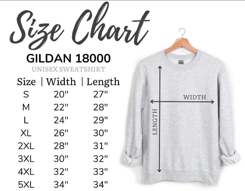 Puede incluir: Una sudadera unisex Gildan 18000 gris claro colgada de una percha de madera. La imagen incluye una tabla de tallas con medidas en pulgadas, equivalentes en cm, para las tallas S a 5XL. La tabla muestra las dimensiones de ancho y largo.