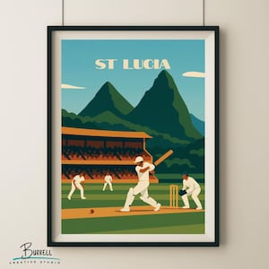 Pode incluir: Impressão artística emoldurada com uma cena de jogo de críquete em Santa Lúcia. A obra retrata jogadores de branco, um estádio e montanhas verdes sob um céu azul. O texto "ST LUCIA" está no topo.