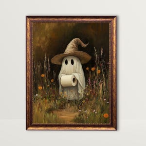May include: A framed art print depicts a whimsical ghost wearing a witch hat and holding a roll of toilet paper. The ghost stands in a field of wildflowers with a path leading through the center. The artwork has a vintage, painterly style.