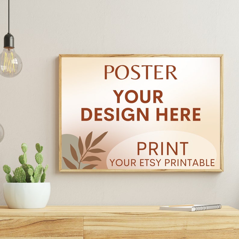 Może przedstawiać: Plakata w ramie z jasnobrązowego drewna. Plakat ma brzoskwiniowe tło z brązowym wzorem liścia i tekstem "POSTER YOUR DESIGN HERE PRINT YOUR ETSY PRINTABLE".