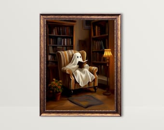 May include: A framed print shows a ghost reading in a library. The ghost, covered in a white sheet, sits in a striped armchair, reading a book. Bookshelves and a warm lamp create a cosy atmosphere. The frame is a dark brown colour.
