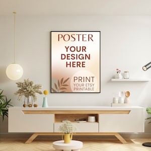 Może przedstawiać: Projekt plakatu z tekstem "POSTER YOUR DESIGN HERE PRINT YOUR ETSY PRINTABLE" w brązowej czcionce na jasno pomarańczowym tle z brązowym wzorem liścia. Plakat wisi na białej ścianie nad białą szafką z drewnianym blatem.