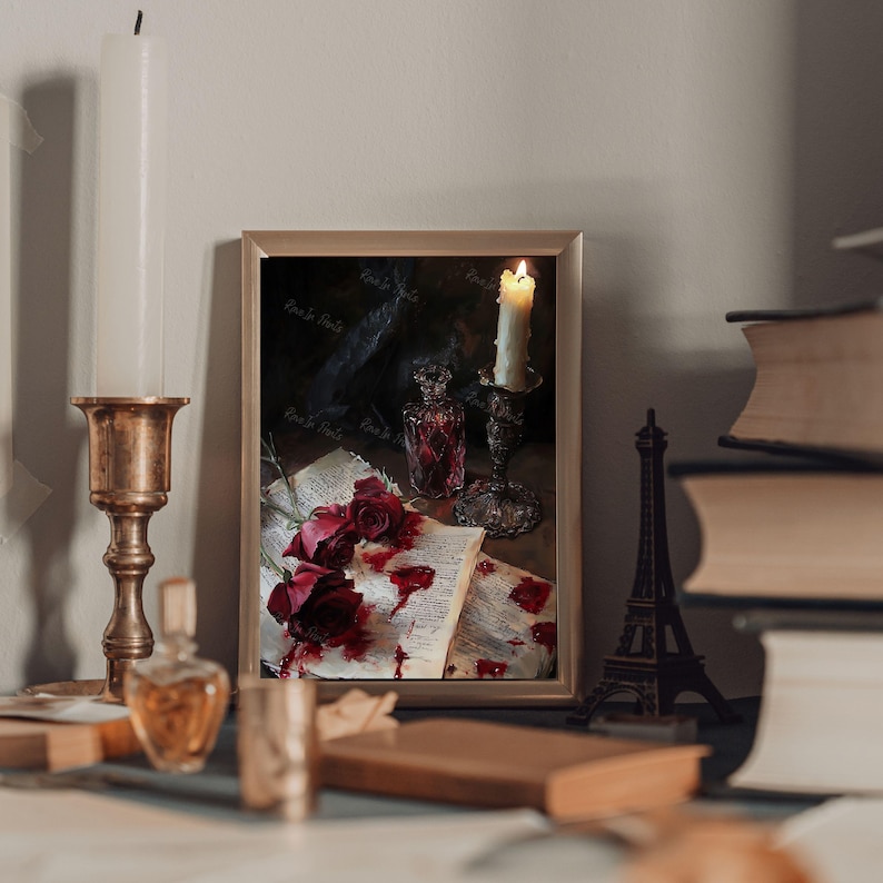 May include: A framed painting of a still life with a lit candle, a glass bottle, and red roses on an open book. The book is covered in blood-red stains.