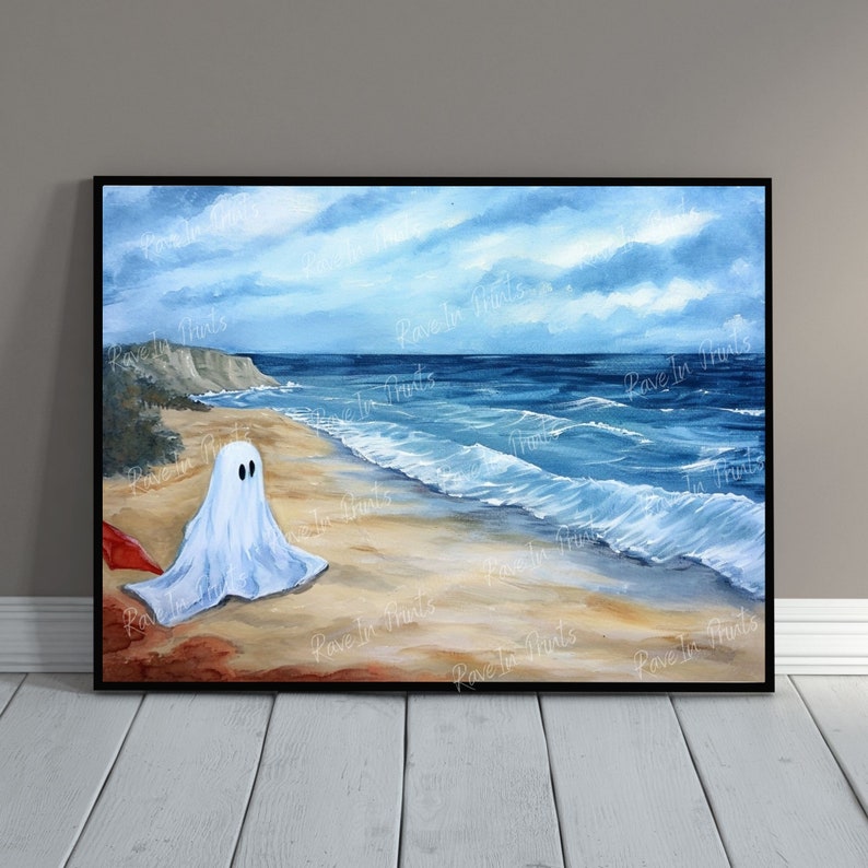 May include: A watercolor painting of a ghost on a beach. The ghost is white and has a blue sheet draped over it. The beach is sandy and the ocean is blue. The sky is cloudy and gray.