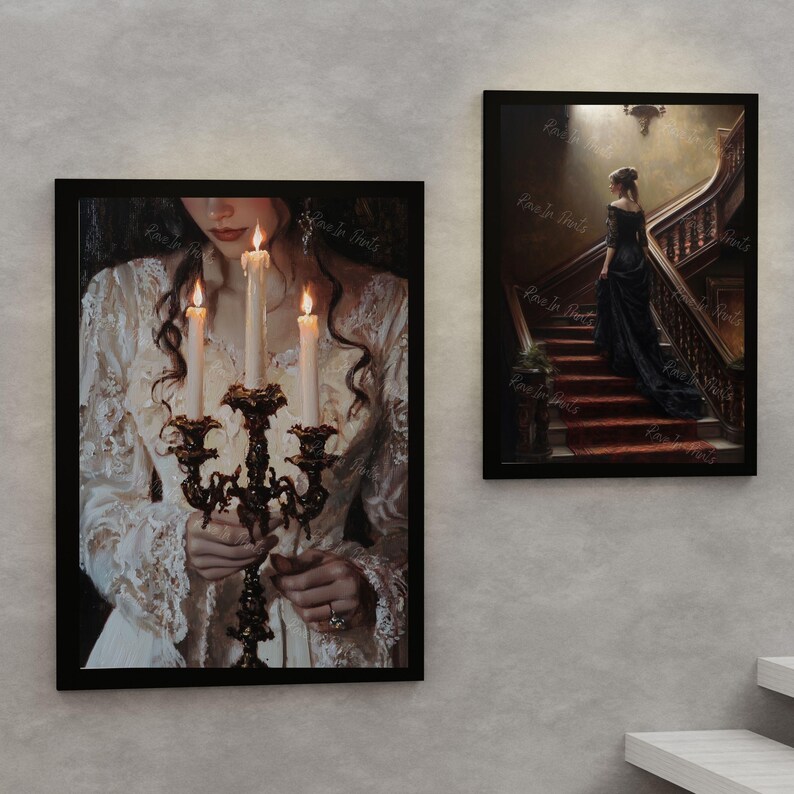 May include: Two framed paintings. The first painting shows a woman in a white dress holding a candelabra with lit candles. The second painting shows a woman in a black dress walking up a staircase.