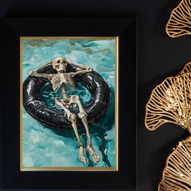 May include: A watercolor painting of a skeleton floating on an inner tube in a turquoise pool. The skeleton is wearing a relaxed pose with arms outstretched and legs crossed. The painting is framed in black.