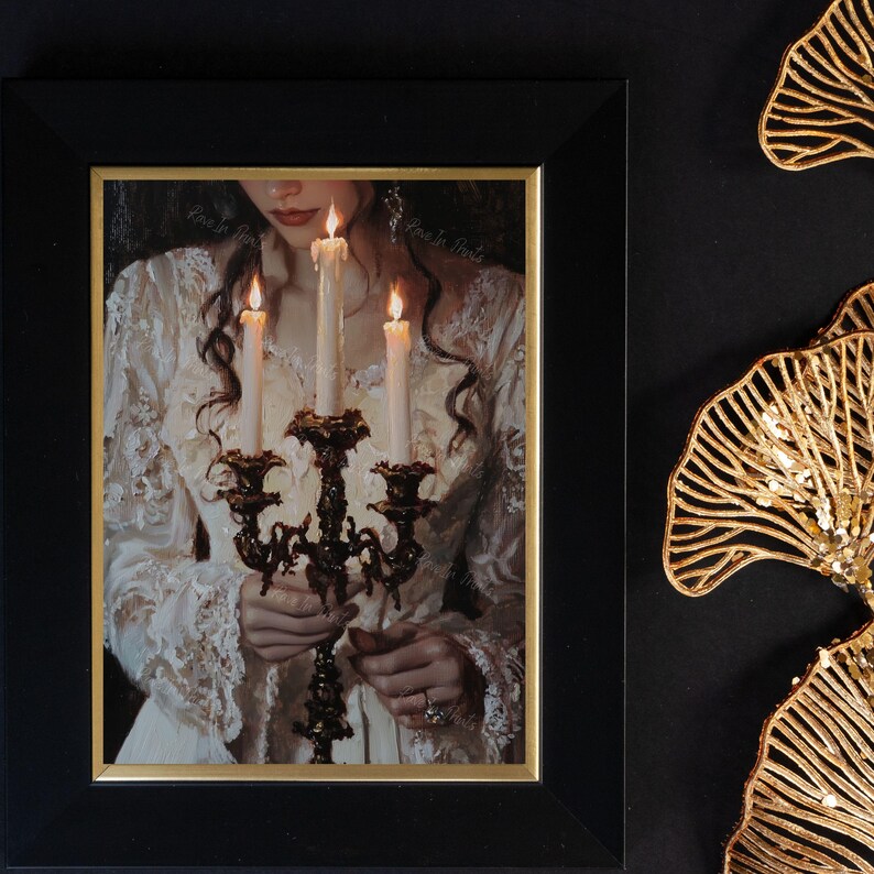 May include: A woman in a white lace dress holds a candelabra with four lit candles. The candles are tall and thin, and the candelabra is ornate with a gold finish.