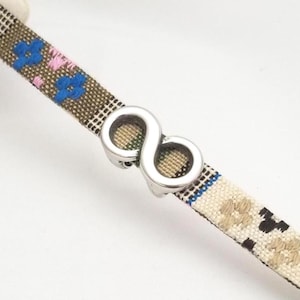 May include: A set of three ceramic nesting bowls in shades of blue, green, and white. The bowls feature a speckled glaze and a simple, modern design. The largest bowl measures approximately 6 inches in diameter.