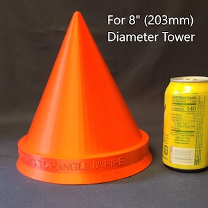 Pode incluir: Um objeto laranja em forma de cone com uma base larga, rotulado como "DECTOP ANGLE 8" PIPE". O texto "For 8" (203mm) Diameter Tower" está acima do cone. Uma lata amarela está ao lado do cone.