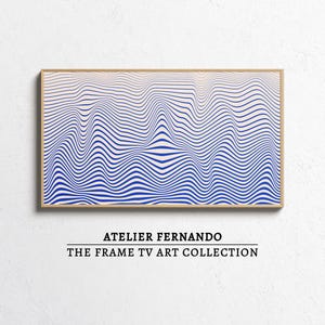 May include: A framed art print featuring a blue and white wavy pattern. The artwork is rectangular and has a wooden frame. The text "ATELIER FERNANDO" and "THE FRAME TV ART COLLECTION" are displayed below the artwork.