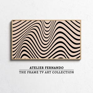 May include: A framed artwork featuring a wavy black and beige pattern. The piece is part of "THE FRAME TV ART COLLECTION" by ATELIER FERNANDO. The design creates an optical illusion of depth and movement, suitable for modern decor.