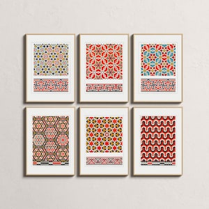 May include: Six framed prints with colorful geometric patterns. The prints feature intricate designs in red, blue, yellow, and orange, with a decorative border at the bottom. The frames are a light brown color, and the prints are displayed on a white wall.