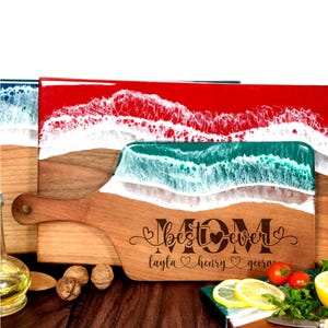 a wooden cutting board with a picture of a beach