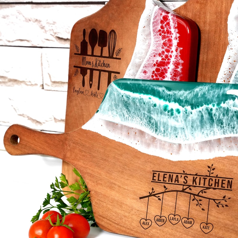 a wooden cutting board with a knife and some tomatoes