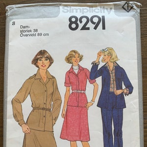 May include: Simplicity sewing pattern number 8291 for a women's outfit. The pattern includes a long-sleeved shirt with a collar and a skirt. The pattern also includes a short-sleeved shirt with a collar and a skirt. The pattern also includes a jacket with a collar and trousers.